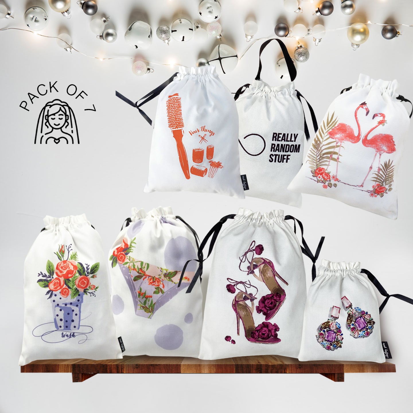 Set of white drawstring bags with various designs on a white background