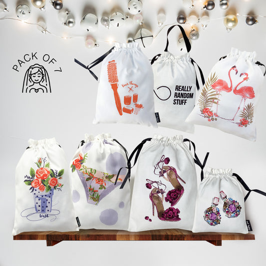Set of white drawstring bags with various designs on a white background