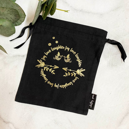 black and gold cotton gift bags that elevate your gift