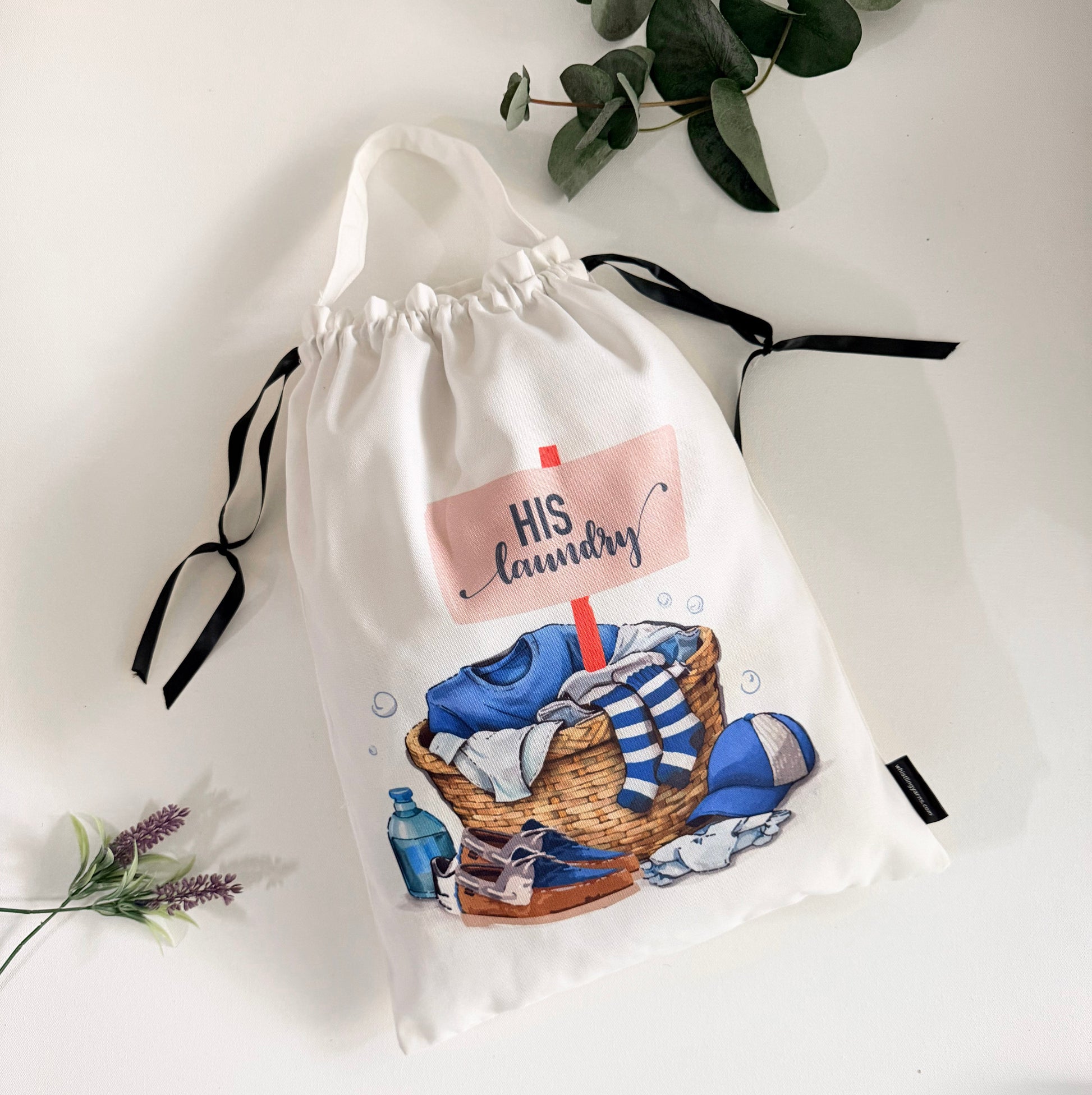 Drawstring bag with laundry bag with 'His Laundry' text on the travel bag.