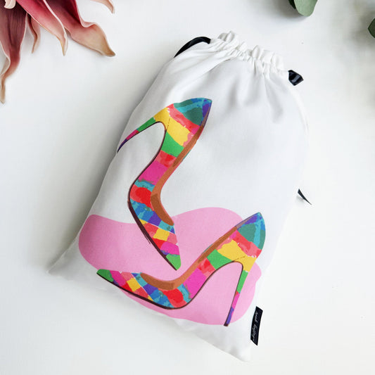 Drawstring bag with colorful high-heeled shoe design on a white background